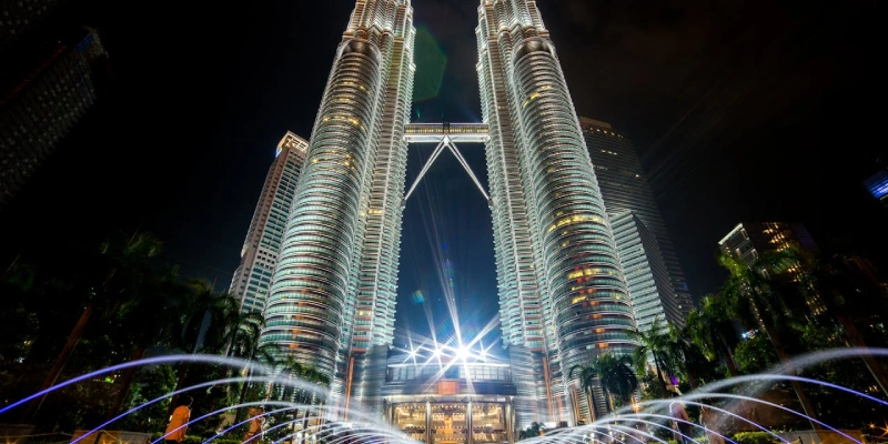 Aerial view of Petronas Twin Towers with the bustling Kuala Lumpur cityscape